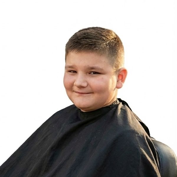 Happy child after a first-chair kids' cut